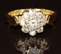 An 18ct gold ring set with diamonds in a cluster, 4.5g, size L