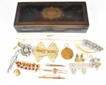 Tahan of Paris brass inlaid rosewood or similar box with vacant cartouche, with contents including
