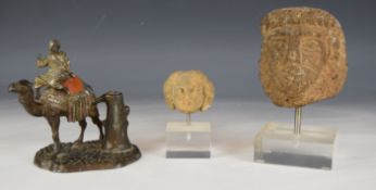 Spelter table lighter formed as a man riding a camel in the manner of Bergmann together with two