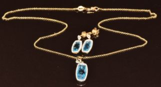 An 18ct gold pendant and matching earrings set with topaz and diamonds, chain- 40cm, earrings- 1.