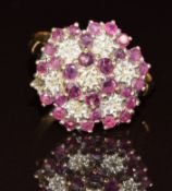 A 9ct gold ring set with diamonds and rubies in a large cluster, 3.7g, size Q