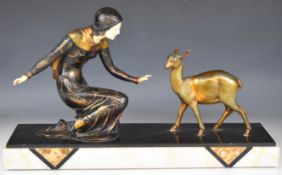 Art Deco figurine having ivorine face and hands with fawn, on marble base, W50 x D16 x H34cm