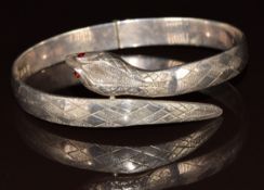 A hallmarked silver bangle in the form of a serpent, London 1973, 28g
