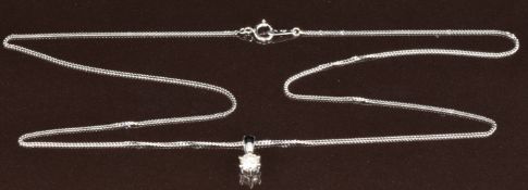 A platinum pendant set with a round cut diamond of approximately 0.25ct, on platinum chain, 3.6g