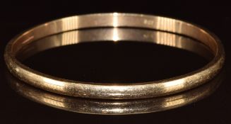 A 9ct gold bangle, 27.1g, 6.5cm