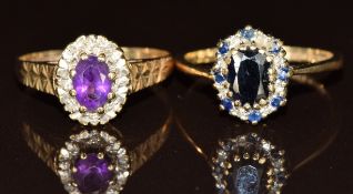 Two 9ct gold rings, one set with an amethyst surrounded by diamonds and the other sapphire and