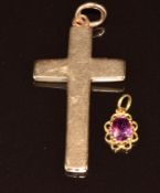 A c1900 15ct gold cross pendant (4.5cm, 3.2g) and a 9ct gold pendant set with an oval cut ruby of