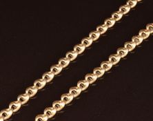 A c1910 yellow metal watch chain (testing as 15k) with 15ct gold clip, 26.2g, 42.5cm