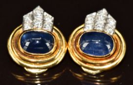 A pair of 18k gold earrings each set with sapphire cabochon of approximately 3.5ct and six round cut