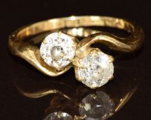 An 18ct gold ring set with two old cut diamonds of approximately 0.37ct & 0.42ct, 2.8g, size J