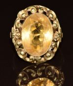 A 14k gold ring set with an oval cut citrine, 4.8g, size N