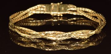 An 18k gold bracelet made up of three plaited strands with textured detail, 22.7g, 20cm