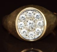 A 9ct gold ring set with cubic zirconia, 6.3g, size V