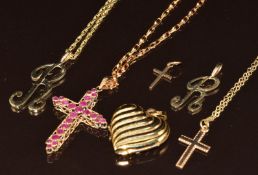 A 9ct gold cross set with sapphires and rubies on 9ct gold chain, 9ct gold heart locket, two 9ct
