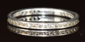 Theo Fennell platinum eternity ring set with round cut diamonds, the total weight approximately 0.