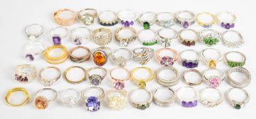 Fifty silver rings including amethyst, cubic zirconia, diopside, garnet, tanzanite, amber, etc,