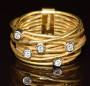 An 18ct gold bespoke ring set with five diamonds, originally purchased from Jenny Wren, hallmarked