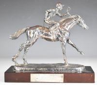 Elizabeth II hallmarked silver model of a horse and jockey on wooden base, Sheffield 1992, maker