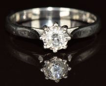 A platinum ring set with a round brilliant cut diamond of approximately 0.2ct, 3.6g, size O