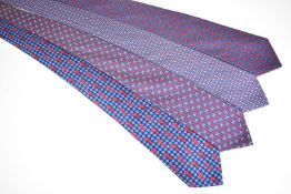 Four Hermès silk ties, one with knight or chess piece decoration