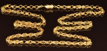 A yellow metal necklace made up of double circular links with a clasp in the form of a hand/ fist,