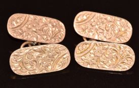 A pair of Edwardian 9ct rose gold cufflinks with engraved floral decoration, Chester 1902, 9g