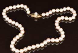 A single strand of cultured pearls, the 14k gold clasp set with a further pearl, 20.7g, 36cm