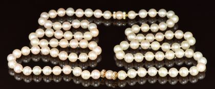 A single strand of cultured pearls, the 18k gold clasp set with diamonds and pearls, can be worn