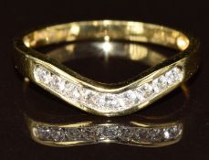An 18ct gold ring eternity ring set with nine diamonds, the total diamond weight approximately 0.