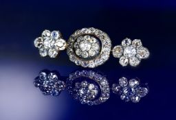 A 19thC gold and silver brooch set with old cut diamonds, the total diamond weight approximately 4.