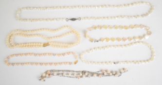 A double strand cultured pearl necklace with 14k gold clasp, a single strand of cultured pearls with