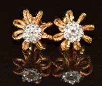 A pair of 18ct gold earrings each set with a diamond of approximately 0.09ct, 3.2g