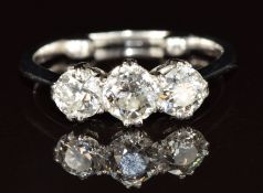 A platinum ring set with three diamonds measuring approximately 0.5ct, 0.35ct & 0.35ct, 3.5g, size G