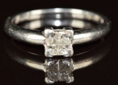 A platinum ring set with four princess cut diamonds, the total diamond weight approximately 0.2ct,