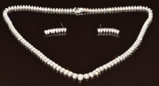 An 18k white gold necklace set with two hundred and forty round cut diamonds, the total diamond