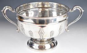 Edward VII hallmarked silver twin handled punch bowl with applied foliate decoration and scroll