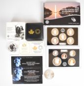 American and Canadian silver coins comprising 2020 Liberty silver dollar, 2019 Canadian $20 coin and