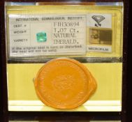 A loose 1.07ct emerald cut emerald in original sealed display case