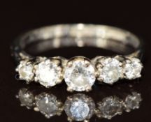 An 18ct white gold ring set with five diamonds totalling approximately 0.7ct, 2.7g, size K