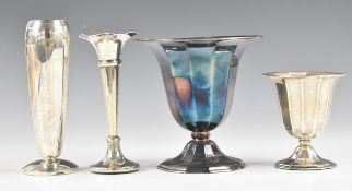Four Dutch silver vases comprising two faceted examples, one with wavy edge and one other, all