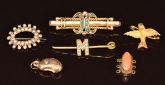 Four c1900 yellow metal brooches (6.2g), a yellow metal clasp set with coral and 9ct gold kidney