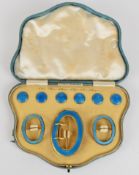 Silver gilt belt buckle and buttons in original fitted box 'T.W.Long & Co' set with blue guilloche