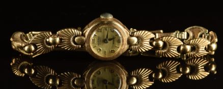Roamer 9ct gold ladies wristwatch with blue hands, silver dial and 17 jewel movement, on 9ct gold