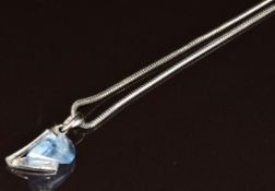 An 18ct white gold pendant set with synthetic spinel (2cm) on 18ct white gold snake chain, 50cm,