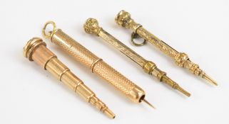 A 9ct gold retractable toothpick and three propelling pencils including one telescopic example