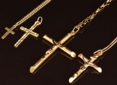 Two 9ct gold crucifixes, two 9ct gold cross pendants and three 9ct gold chains, 13.4g