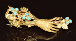 Victorian brooch in the form of a hand and flowers set with faux turquoise and a ruby, 4.6g, 3.5cm