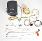 A collection of jewellery including two silver bangles, silver necklace, three silver rings,