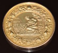 A 9ct gold Horticultural Society medallion with embossed gardening scene with fruit and flower