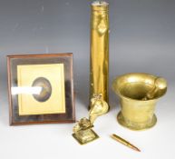 Brass pestle and mortar, shell case, 19th century brass cobra and a daguerreotype in a mahogany